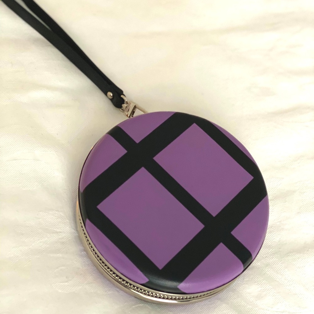 Beautiful round leather clutch with handle